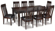 Haddigan Dining Table and 8 Chairs in Dark Brown by Ashley at Eve Furniture