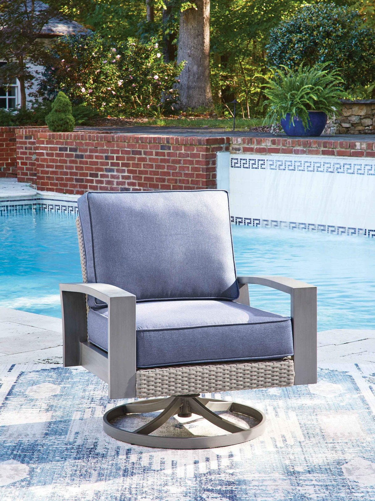 Half Moon Beach Blue/Gray Outdoor Swivel Lounge Chair with Cushion by Ashley at Eve Furniture