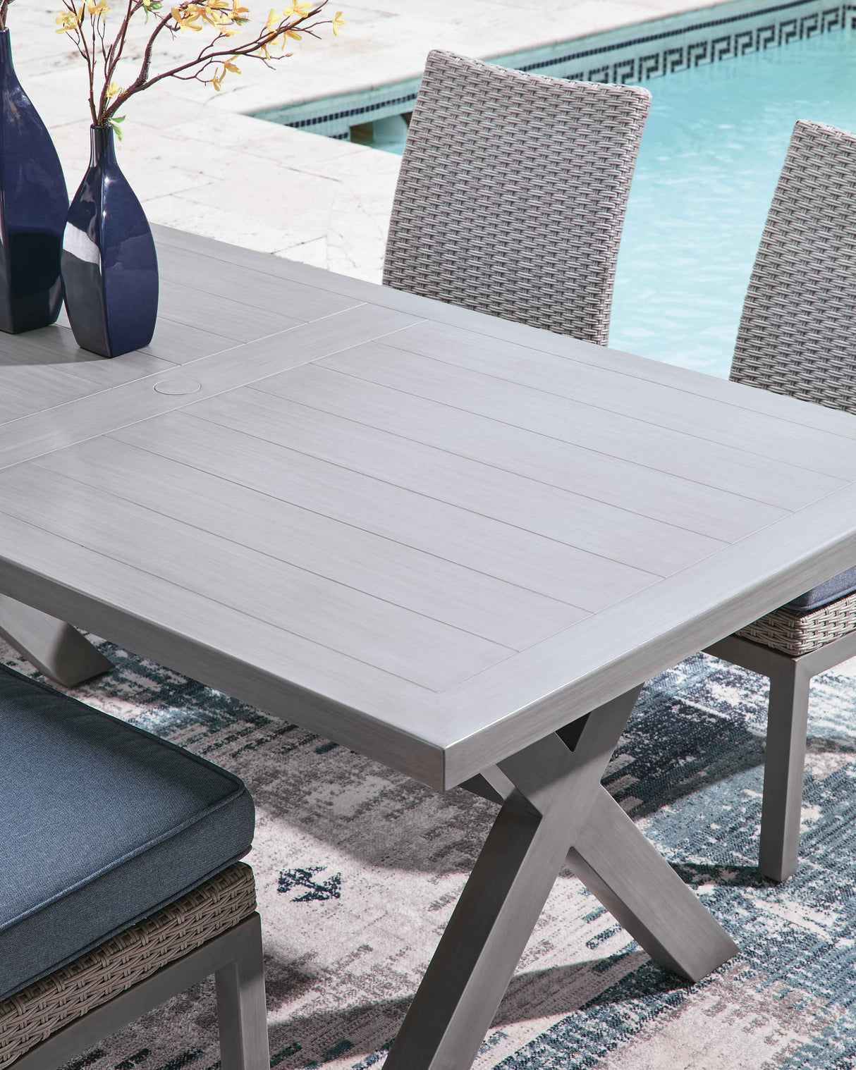 Half Moon Gray Beach Outdoor Dining Table and 6 Armchairs by Ashley at Eve Furniture