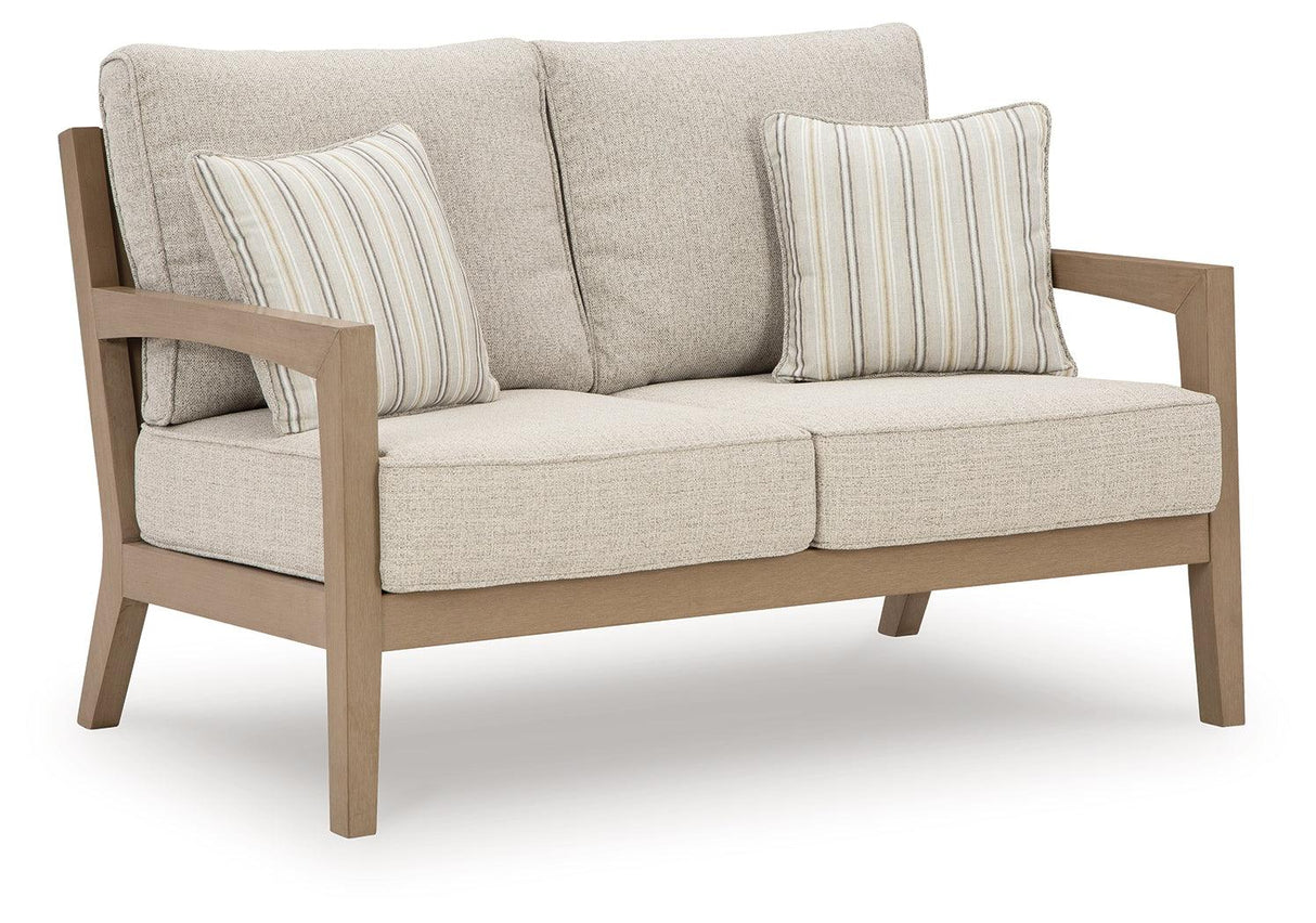 Hallow Creek Driftwood Outdoor Loveseat with Cushion by Ashley at Eve Furniture