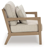 Hallow Creek Driftwood Outdoor Loveseat with Cushion by Ashley at Eve Furniture
