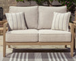 Hallow Creek Driftwood Outdoor Loveseat with Cushion by Ashley at Eve Furniture