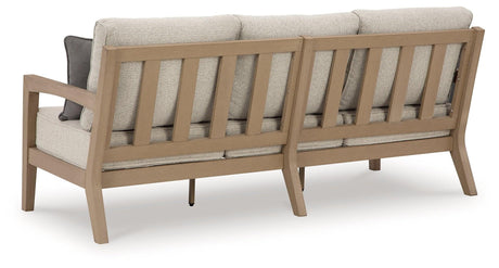 Hallow Creek Driftwood Outdoor Sofa with Cushion by Ashley at Eve Furniture
