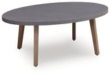 Harmony Headlands Natural/Gray Oval Cocktail Table by Ashley at Eve Furniture
