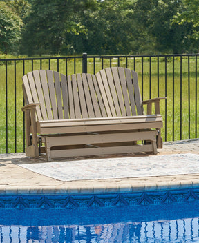 Hyland wave Driftwood Outdoor Glider Loveseat by Ashley at Eve Furniture