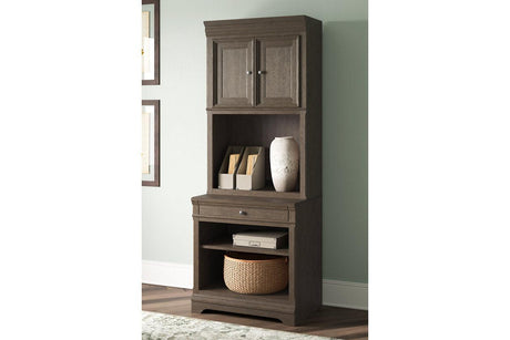 Janismore Weathered Gray Bookcase by Ashley at Eve Furniture
