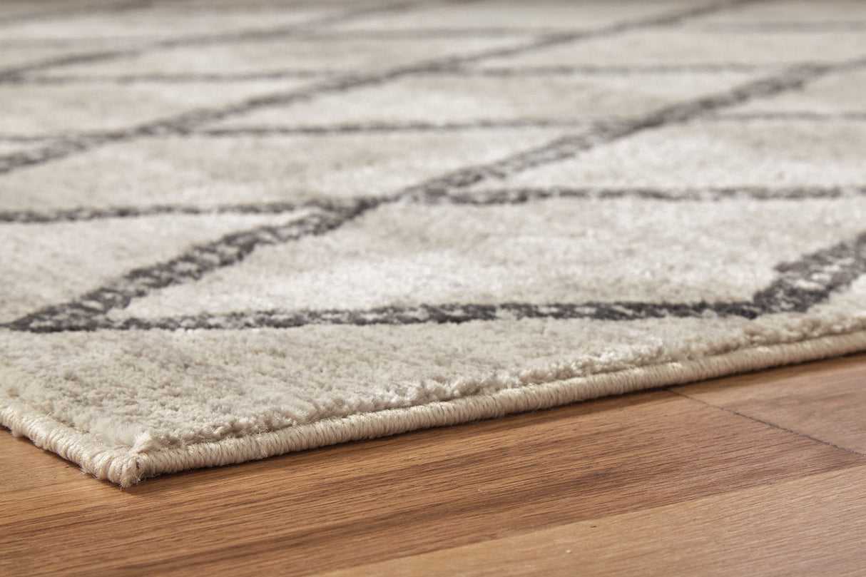 Jarmo Cream/Gray 5' x 7' Rug by Ashley at Eve Furniture