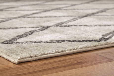 Jarmo Cream/Gray 5' x 7' Rug by Ashley at Eve Furniture