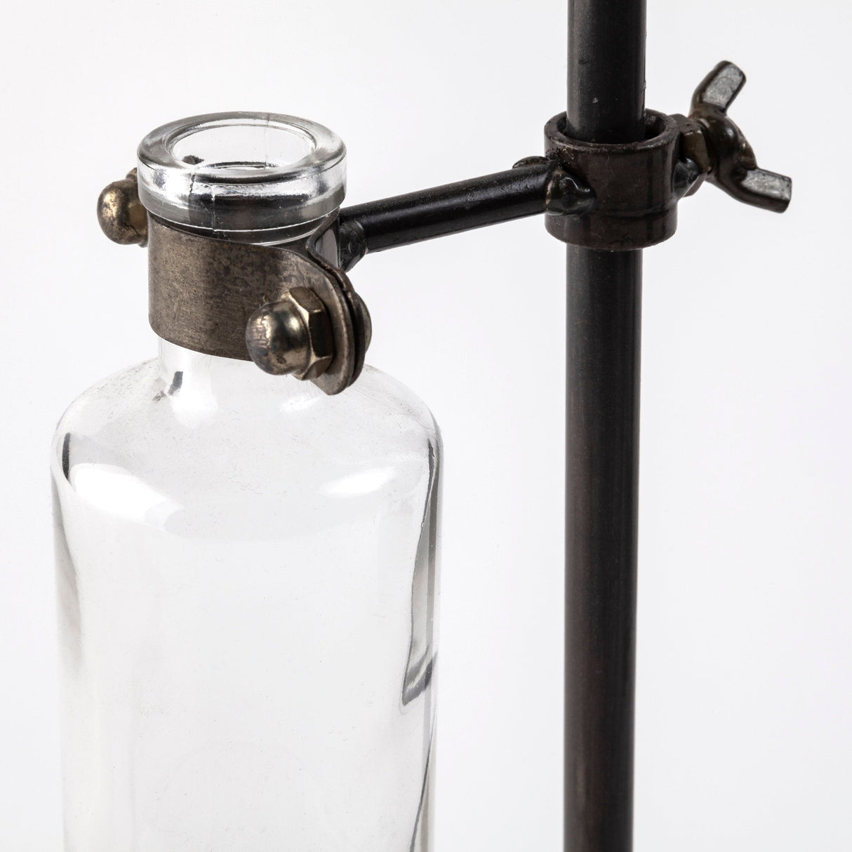 Jarvis Set of Five Dark Brown Metal and Glass Chemistry Inspired Bottles by Mercana at Eve Furniture