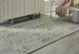 Jossland Turquoise/Ivory Medium Rug by Ashley at Eve Furniture