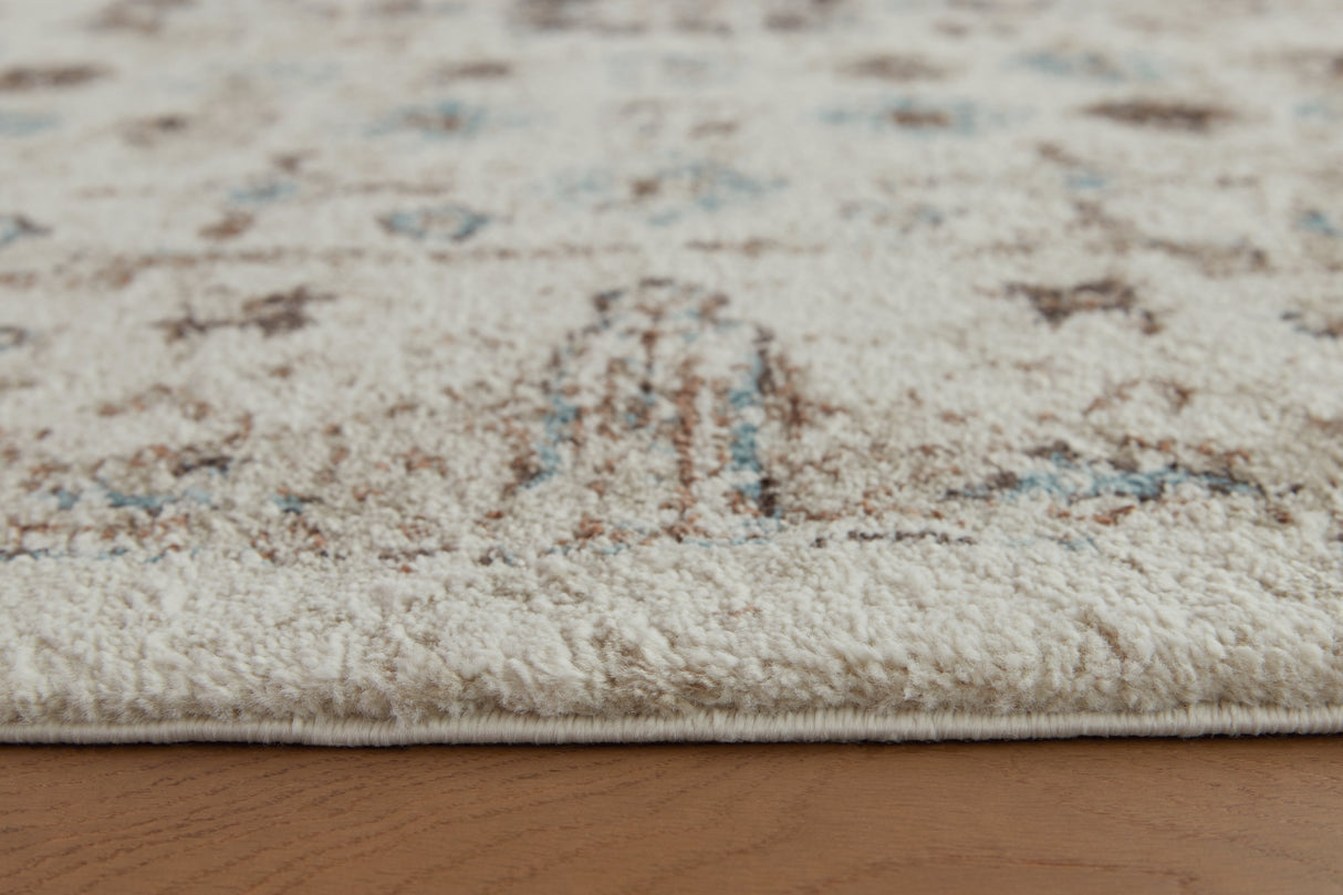Jossler Ivory/Brown/Teal Large Rug by Ashley at Eve Furniture