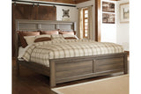 Juararo Dark Brown California King Panel Bed by Ashley at Eve Furniture