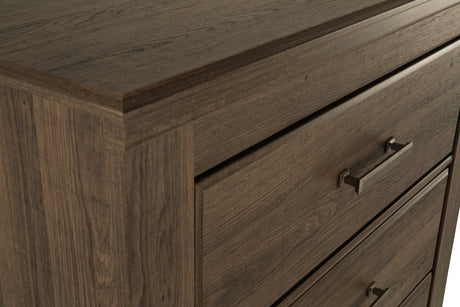 Juararo Dark Brown Poster Bedroom Set by Ashley at Eve Furniture