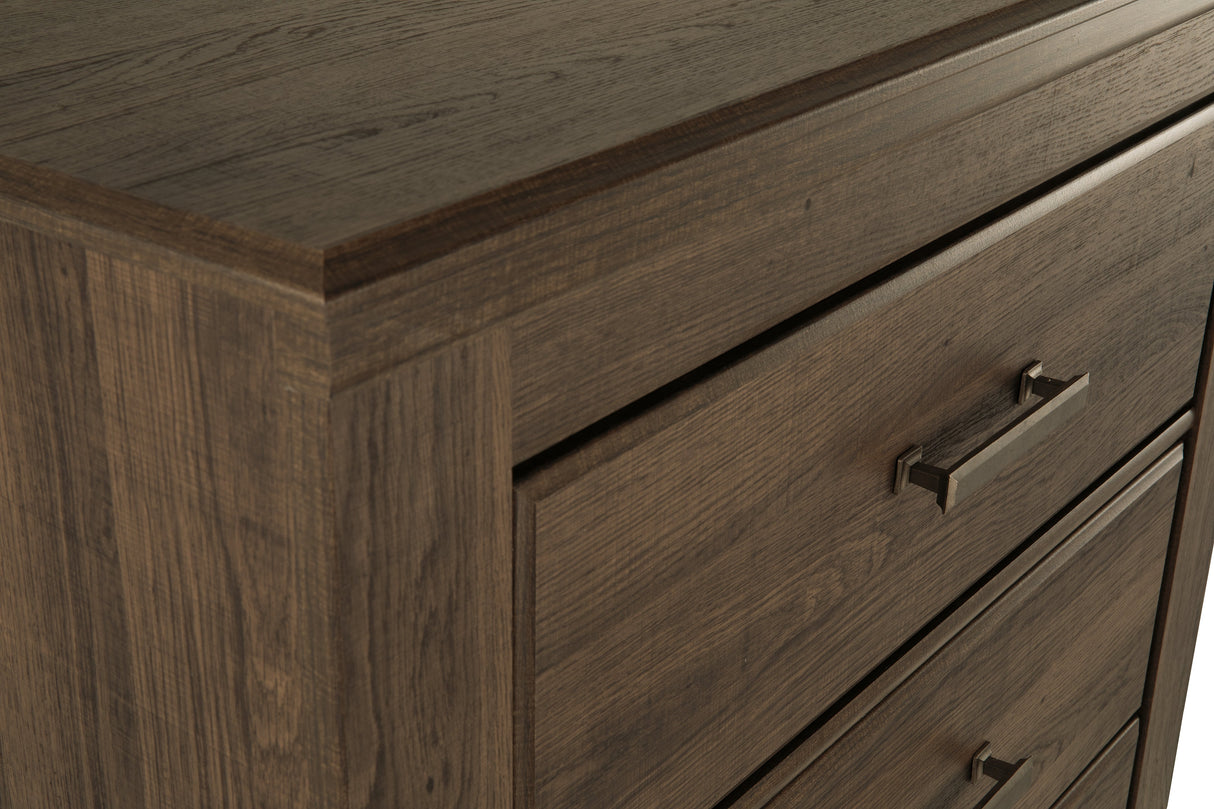 Juararo Dark Brown Poster Bedroom Set by Ashley at Eve Furniture
