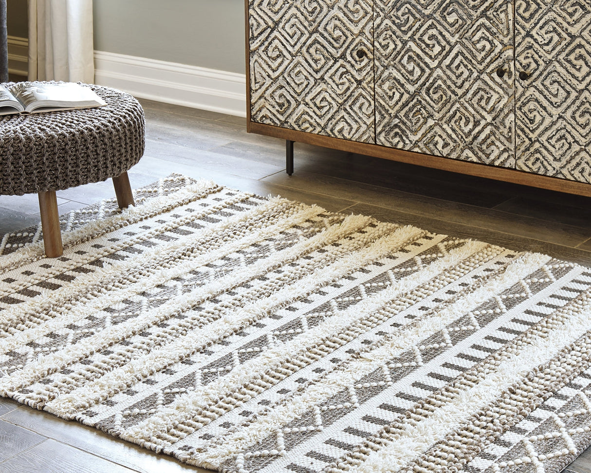 Karalee Ivory/Brown 8' x 10' Rug by ASHLEY FURNITURE at Eve Furniture