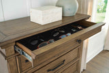 Karallin Medium Brown Chest of Drawers by Ashley at Eve Furniture