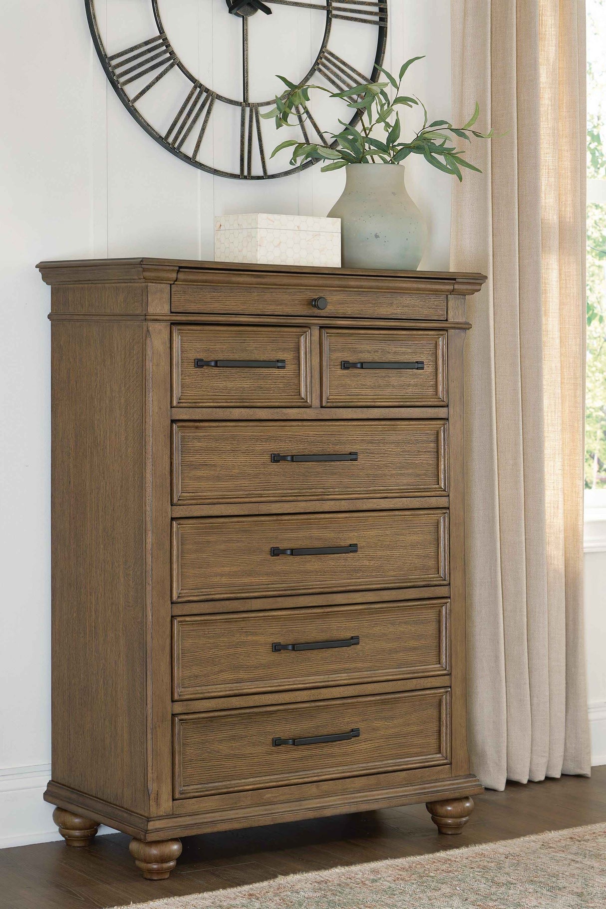 Karallin Medium Brown Chest of Drawers by Ashley at Eve Furniture