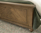 Karallin Medium Brown Panel Bedroom Set by Ashley at Eve Furniture