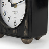 Karl 6.0L x 3.0W x 6.8H Rustic Black Iron Rounded Square Table Clock by Mercana at Eve Furniture