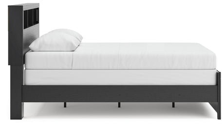 Kendanport Brown/White Upholstered Bedroom Set features elegant upholstered details, a stylish brown and white finish, and modern craftsmanship, perfect for creating a sophisticated bedroom retreat. by Ashley at Eve Furniture