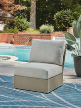 Kimpton Isle Brown/Beige Outdoor Armless Chair with Cushion by ASHLEY FURNITURE at Eve Furniture