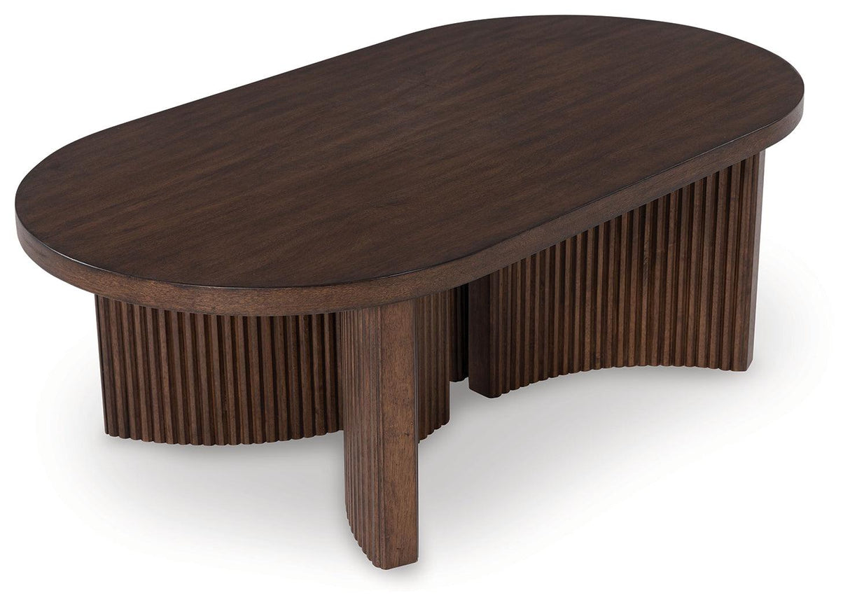 Korestone Dark Brown Coffee Table by Ashley at Eve Furniture