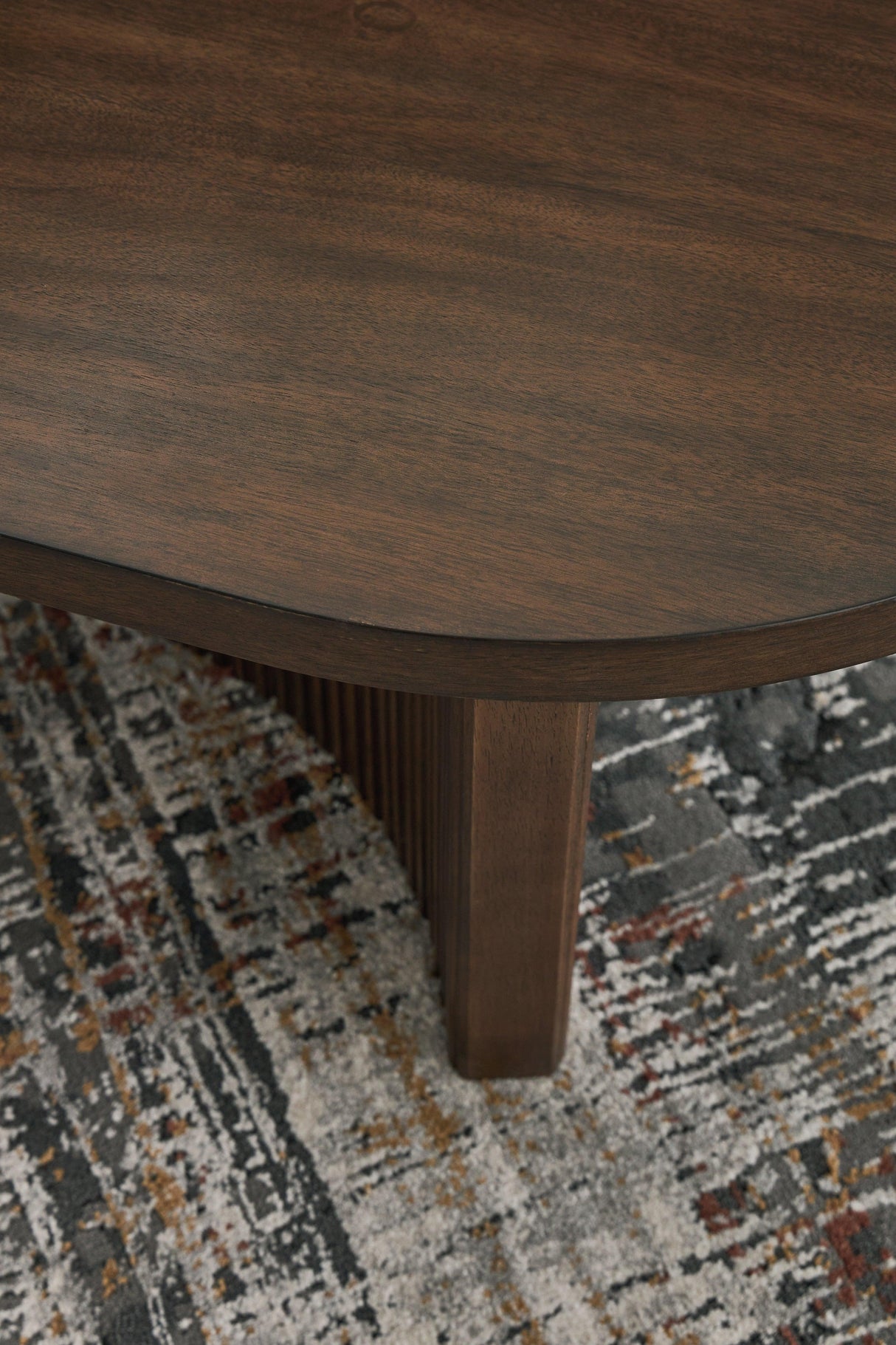 Korestone Dark Brown Coffee Table by Ashley at Eve Furniture