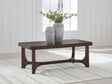 Korestone Dark Brown Coffee Table by ASHLEY FURNITURE at Eve Furniture