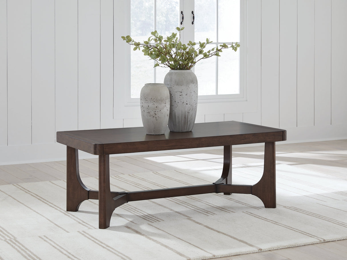 Korestone Dark Brown Coffee Table by ASHLEY FURNITURE at Eve Furniture