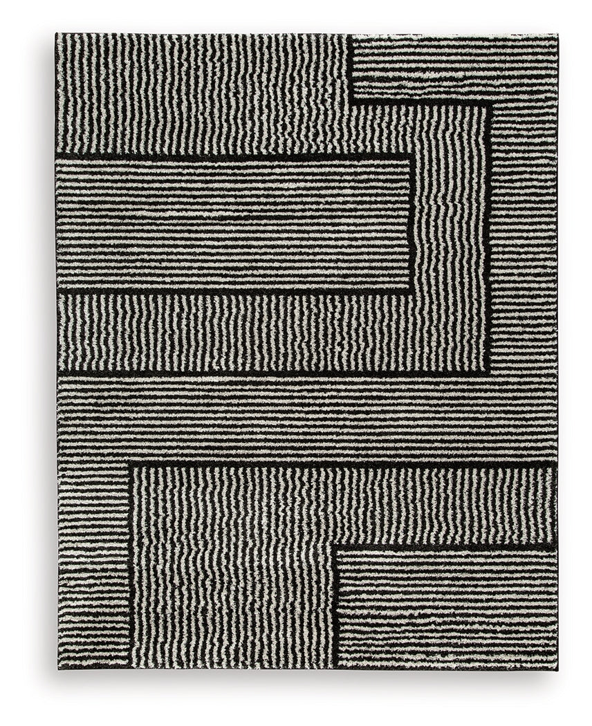 Kurtmen Black/Ivory Large Rug by Ashley at Eve Furniture