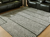 Kurtmen Black/Ivory Large Rug by Ashley at Eve Furniture