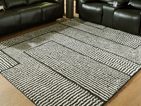Kurtmen Black/Ivory Large Rug by Ashley at Eve Furniture