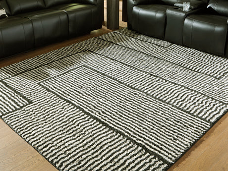 Kurtmen Black/Ivory Large Rug by Ashley at Eve Furniture