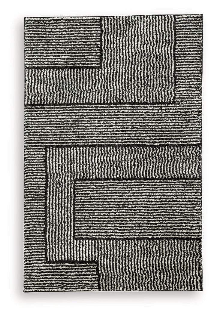 Kurtmen Black/Ivory Medium Rug by Ashley at Eve Furniture