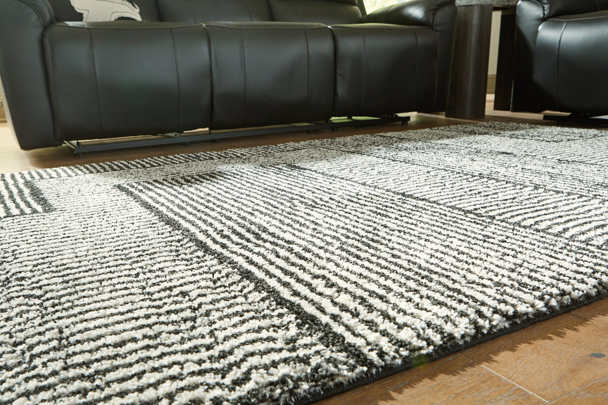 Kurtmen Black/Ivory Medium Rug by Ashley at Eve Furniture