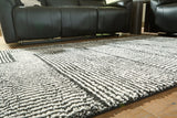 Kurtmen Black/Ivory Medium Rug by Ashley at Eve Furniture