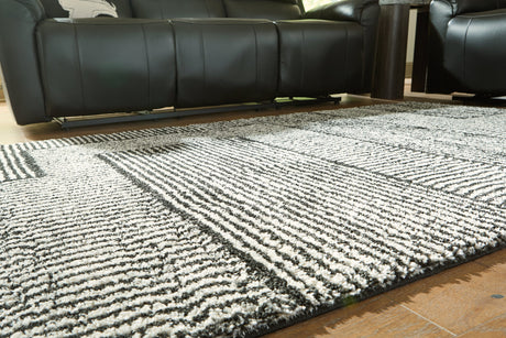 Kurtmen Black/Ivory Medium Rug by Ashley at Eve Furniture