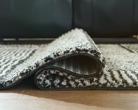 Kurtmen Black/Ivory Medium Rug by Ashley at Eve Furniture
