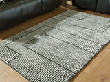 Kurtmen Black/Ivory Medium Rug by Ashley at Eve Furniture
