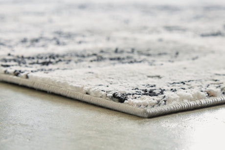Langwell Black/Gray/White Medium Rug by Ashley at Eve Furniture