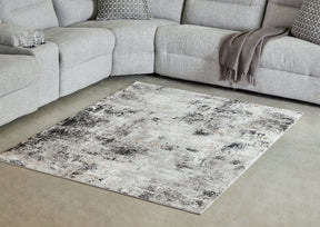 Langwell Black/Gray/White Medium Rug by Ashley at Eve Furniture