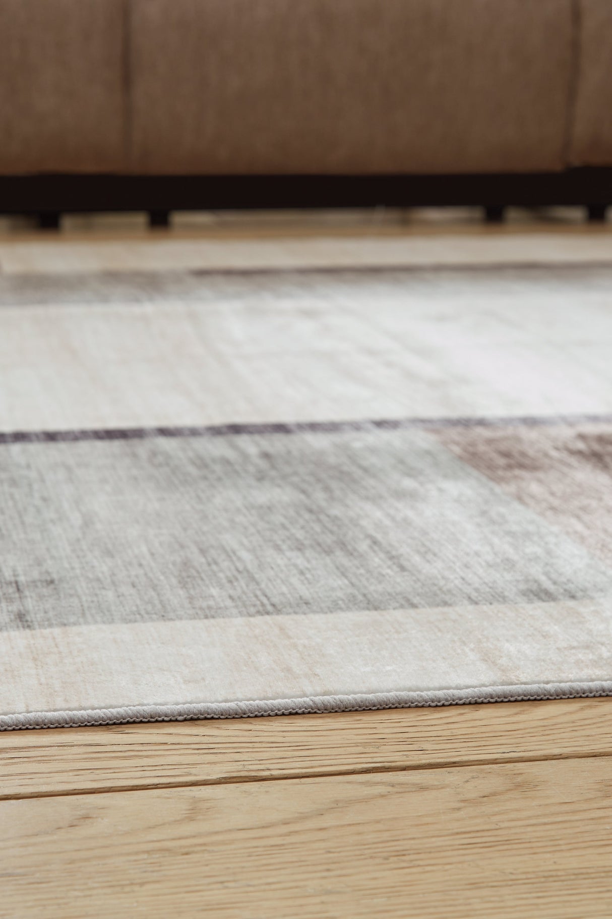 Larkport Cream/Brown/Gray Washable Large Rug by Ashley at Eve Furniture