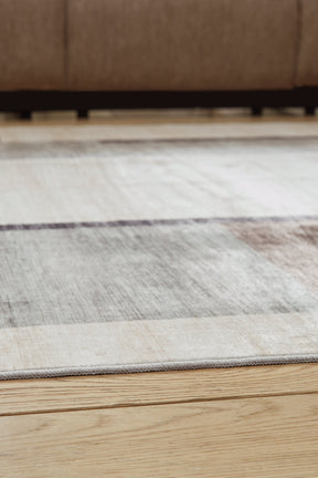 Larkport Cream/Brown/Gray Washable Large Rug by Ashley at Eve Furniture