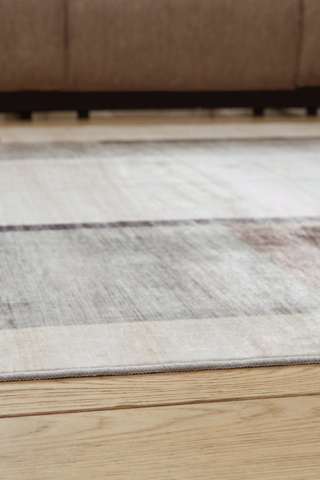 Larkport Cream/Brown/Gray Washable Large Rug by Ashley at Eve Furniture