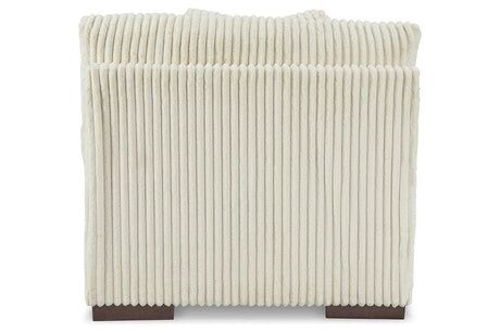 Lindyn Ivory Armless Chair by Ashley at Eve Furniture