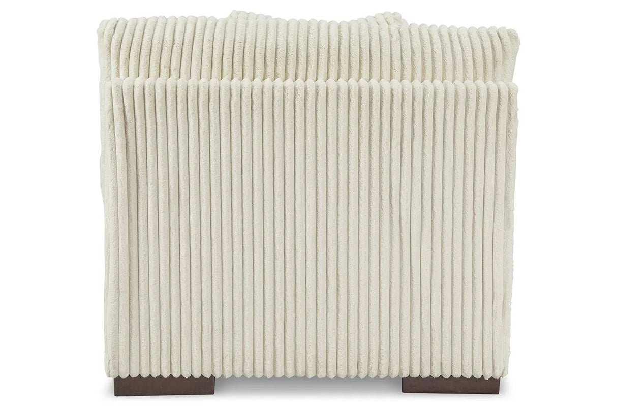 Lindyn Ivory Armless Chair by Ashley at Eve Furniture
