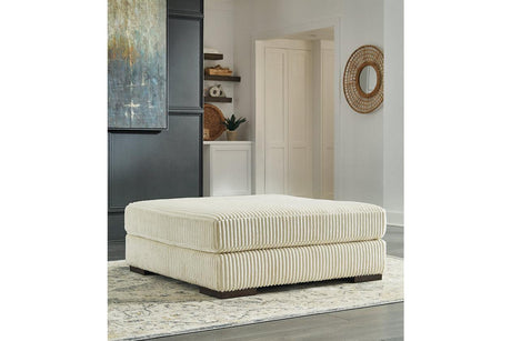 Lindyn Ivory Oversized Accent Ottoman by Ashley at Eve Furniture