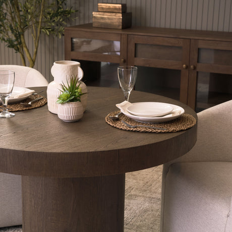 Lyonne Round Medium Brown Oak Wood Pedestal Dining Table by Mercana at Eve Furniture