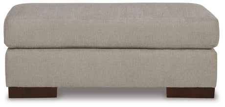 Maggie Flax Ottoman by Ashley at Eve Furniture
