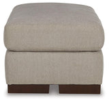 Maggie Flax Ottoman by Ashley at Eve Furniture